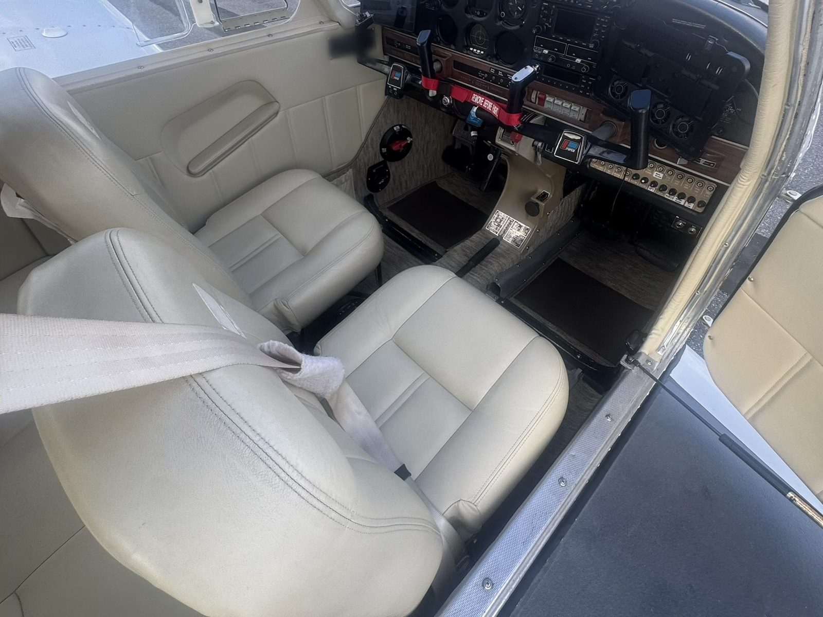 The cabin of the Warrior II with cream leather front seats and dual control yokes